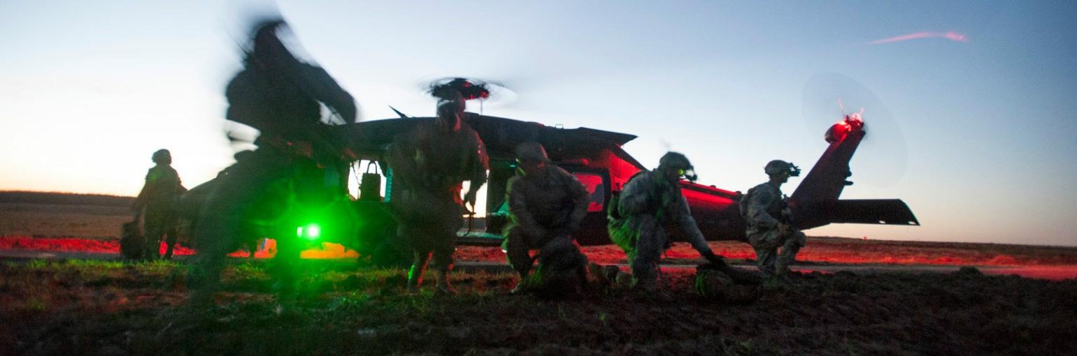 Soldiers exit a UH-60 Blackhawk.