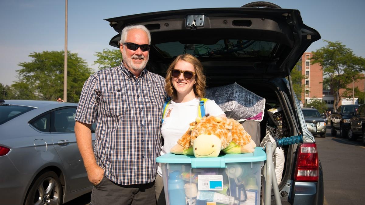 Parents helping students move in to their new dorms. 